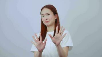 Woman waving hand indicating stop action video