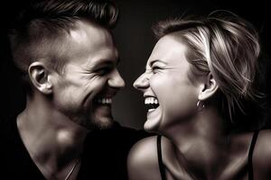 A middle-aged man and woman laugh emotionally and look at each other. photo