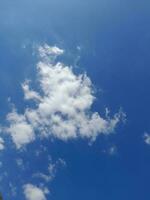 The white clouds on the blue sky are perfect for the background.  Skyscape on Lombok Island, Indonesia photo