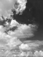 Beautiful grey clouds on sky background. Large bright soft fluffy clouds are cover the entire blue sky. photo