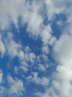 The white clouds on the blue sky are perfect for the background.  Skyscape on Lombok Island, Indonesia photo