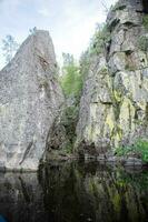Ladoga Skerries Nature Reserve in summer. The shore is made of sheer cliffs. photo