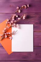 White and Orange Paper Card Mockup with Copy Space and Blossom Branch on Wooden Table Top. . photo