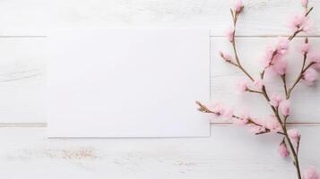 blanco blanco papel tarjeta Bosquejo y rosado florecer rama en de madera textura mesa cima. generativo ai. foto