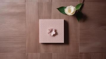 Top View of Embossed Paper Card and Beautiful Flowers on Wooden Texture Table, . photo