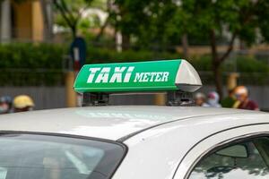 Green Vietnamese taxi meter sign photo
