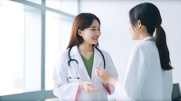 Cropped Image of Asian Female Doctors Talking Each Other in Hallway of Hospital, . photo