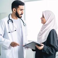 Portrait of Male Doctor Communicating with Muslim Female Colleague or Patient in Hospital or Clinic, . photo