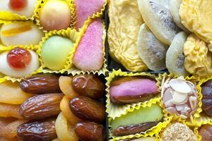 Candies and dried fruits photo