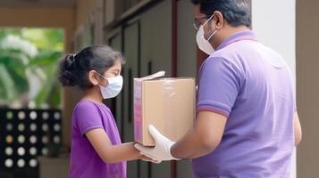 Side View Portrait of Middle Aged Indian Delivery Man Giving Cardboard Box to Customer Girl in Protective Mask at Doorstep, . photo