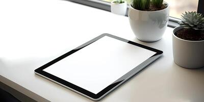 Realistic tablet mock-up for app presentations. The tablet Mockup from above lies slightly slanted on a wooden desk - photo