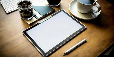 Digital tablet, blank screen mock up with coffee cup, and pen on wooden table. photo