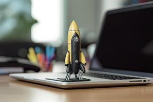 Rocket taking off from laptop screen on top of office desk, successful startup concept, photo