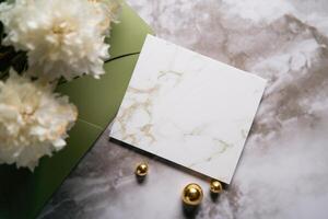 Top View of Blank Card with Golden Pearls, Peony Flowers on Grey Marble Background. Mock up Poster for Design or product placement created using . photo