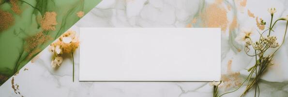 Top View of Blank White Invitation Card with Tiny Flowers on Green and White Marble Background. Mock up Banner for Design or product placement created using . photo