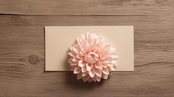 Top View of Beautiful Dahlia Flower at Rectangle Paper Card Mockup on Wooden Table, . photo