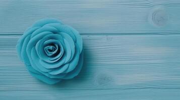 Top View of Beautiful Blue Rose on Plank Texture Table, . photo