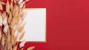 Top View of Empty Paper with Rye Stalks on Red Background. Vintage Delicate Business or Wedding Card Design and Placement. . photo