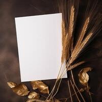 Top View of Blank White Paper with Golden Wheat, Leaves on Brown Texture Background and Placement. Vintage Delicate Business or Wedding Card Design. Generative AI. photo