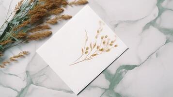 Top View of Vintage Delicate Paper with Pampas Flowers on White and Green Marble Background. Spring or Wedding Card Design. . photo