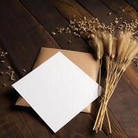 Blank White Invitation Card Mockup with Dried Pampas Grass Decoration on Wooden Background. . photo