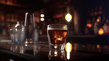 Ice Cube in Whiskey Glass on Table. Blurred Interior of Pub at the Background. . photo