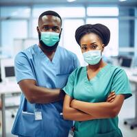 Portrait of African Male and Female Doctor Wearing Masks While Standing in the Hospital Area, . photo