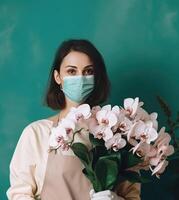 Portrait of Young Woman Wearing Mask and Holding Beautiful Orchid Bouquet, . photo