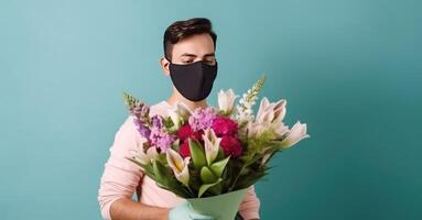 Closeup Portrait of Young Man Wearing Mask and Holding Beautiful Floral Bouquet, . photo