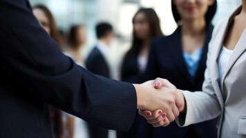 Cropped Image of Business handshake between two women Inside a modern bright office. . photo