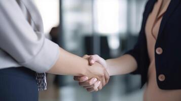 Cropped Image of Business handshake between two women Inside a modern bright office. . photo