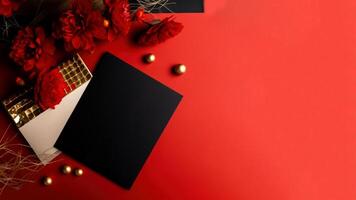 Top View of Invitation Card, Paper Mockup with Beautiful Chrysanthemum Flowers, Golden Pearls on Red Background. . photo