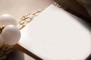 Closeup Flat Lay of Blank Paper Card Mockup with Pearls, Jewellery on Beige Background, Generative AI. photo