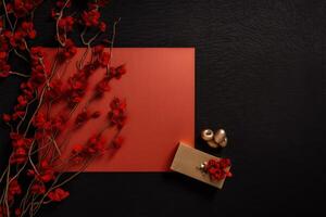 Flat Lay Blank Paper Card Mockup, Gold Objects, Jewellery Box and Artificial Red Flower Branch on Dark Background. Minimal Aesthetic Wedding Invitation Template. . photo