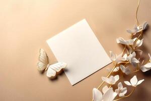 Top View of Blank White Paper Card Mockup and Artificial Flowers Branch Having Bright Light Color Incredibly Detailed Butterfly. . photo