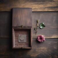 Vintage Silver Square Coin Inside Open Wood Box and Rose Flower on Plank Texture Table Top, . photo