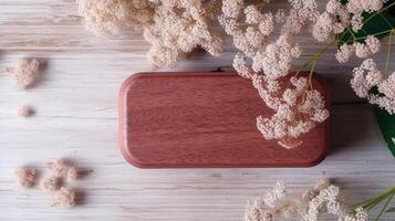 Top View of Closed Vintage Wooden Box and Gypsophila Flower Branch on White Plank Texture Table, . photo