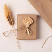 Top View of Rustic Style Packed Gift Box with Dried Pampas Grass and Burlap Cloth on Beige Background, . photo