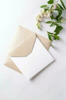 Overhead View of Greeting Card Envelope with White Wisteria Flower Branch for Wedding or Spring Concept. photo