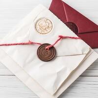Overhead View of Wax Sealed Old White and Red Letter and Envelope on Wooden Background. . photo