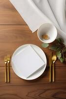 Top view of Dining Table with Blank White Card, Green Leaves and White Silk on Brown Wooden Background. Party or Wedding Vertical Template Design. . photo