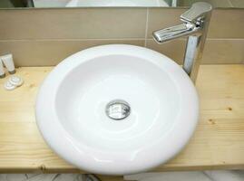 Round white sink in modern bathroom photo