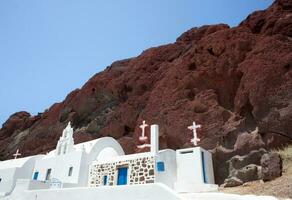 Chapel in red beach, Santorini photo