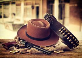 Western accessories on the rustic table. photo