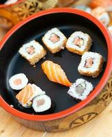 Japanese sushi on a rustic background. photo