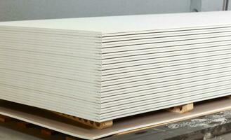 Stacking of white gypsum panels photo