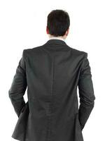 Young businessman turning his back to camera photo