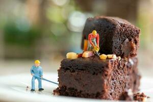 Miniature people, An employee is making a chocolate brownie photo