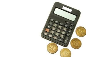 calculator and coin bitcoin isolated on white background, calculation of profitability. photo