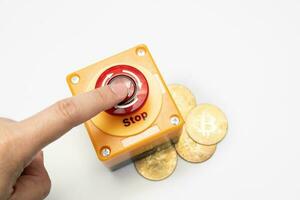 crypto currency price stop loss concept, big red pushing emergency stop button on white background. financial disaster and crisis protection when market price fall. photo